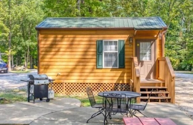 Deluxe Cabin (w/Bathroom) - Deluxe Cabin (w/Bathroom) Better than a motel! Enjoy camping in comfort! Kitchen with stove top and full size fridge with dishes pots included. Full bathroom with shower. Cable TV DVD player. Gas grill on your own concre