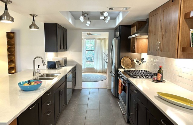 Designer bedroom & bath in creatively renovated 70s ranch. Pkg, grill, patios.