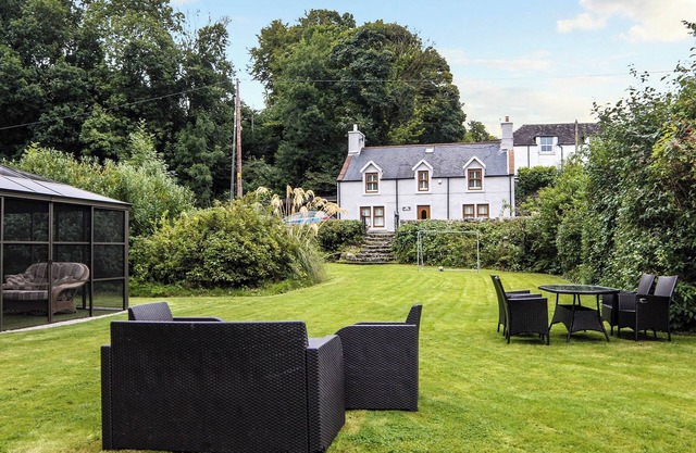 Detached property with a lovely garden leading down to the River Cree near Newton Stewart.