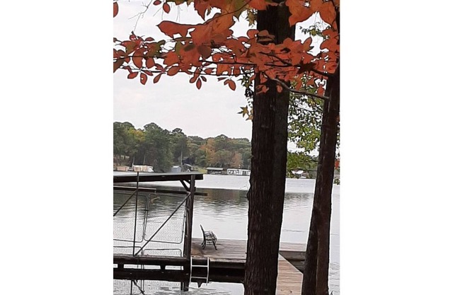 Dock Holiday is a lakefront home with hot tub. Bring your fishing pole.