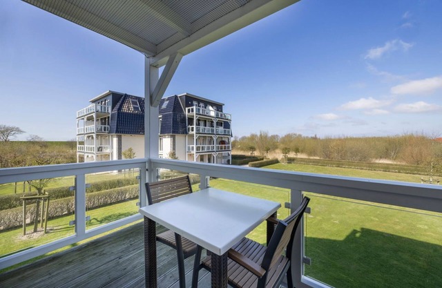 Dog-friendly vacation apartment near the beach with sauna and balcony with beach chair -