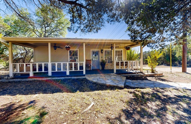 Dog-friendly country cottage with scenic hill views, wrap-around porch, and W/D