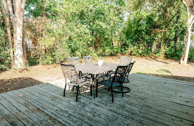 Dog-friendly home with private yard, furnished deck, central AC, & W/D