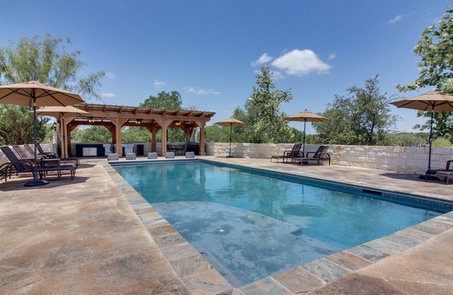 Dog-friendly riverfront home with private pool, gourmet amenities, & guesthouse