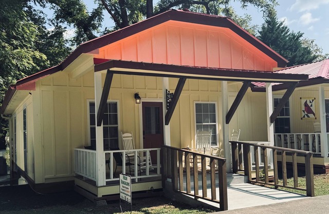 Downtown by Chattahoochee River, sit on front porch as horse and buggy stroll by