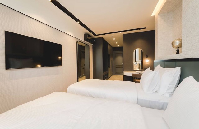 Elegant Haven w/City Views – Breakfast, Parking, Private Balcony
