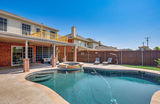 Enjoy the peace and quiet back patio with Lagoon pool.