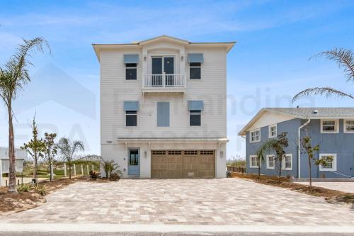 Experience oceanfront luxury with this spacious 5-bedroom house