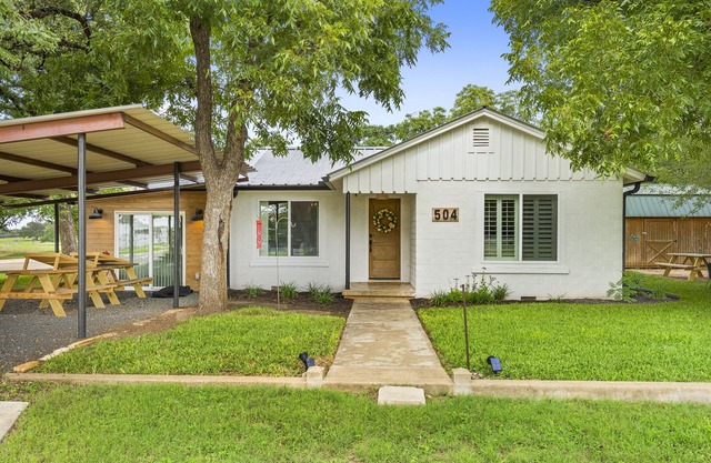 Fully restored 1960s home, large corner lot, 6 Beds, blocks from town center.