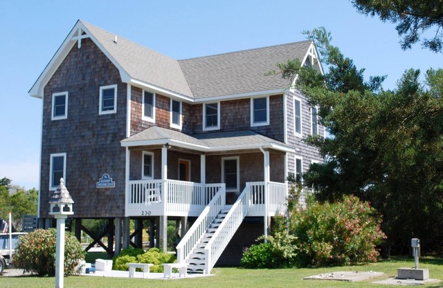 Good Medicine is a canal front home with reverse floor plan and expansive views.