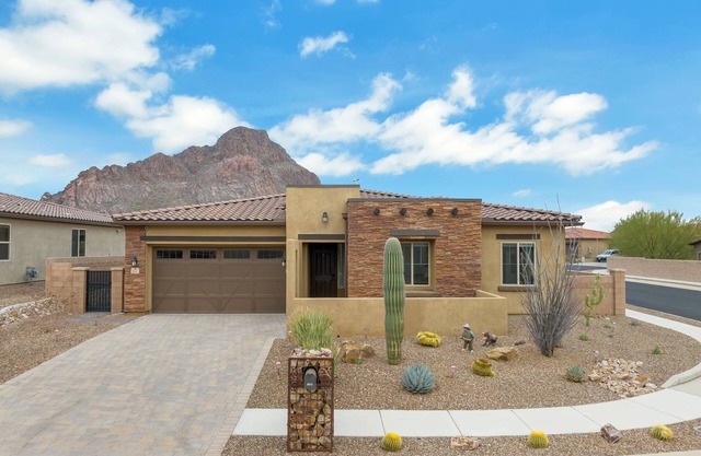 Gorgeous custom home with spa, heated pool, outdoor kitchen and game room!