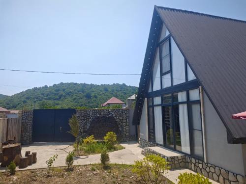 Guba A-frame near forest & lake