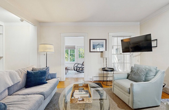 Historic home steps from the harbor with enclosed porches & gorgeous deck