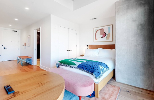 Historic Rainey Street condo with city views, balcony, WiFi, and rooftop pool