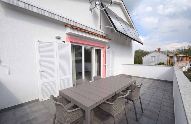 Holiday apartment with air conditioning and balcony