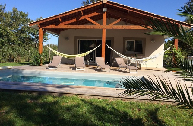 Holiday home with heated swimming pool