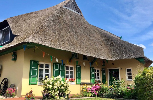 In the thatched roof house