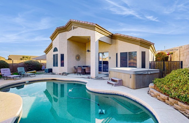 Inviting home with pool, hot tub, enclosed yard, fast WiFi, & W/D