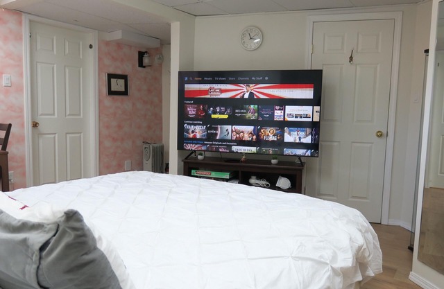 King bed private suite with 65' 4K television