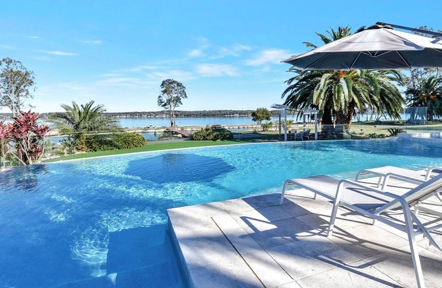 Lake Palm Resort Luxury Retreat absolute Waterfront on 3 acres at Lake Macquarie.