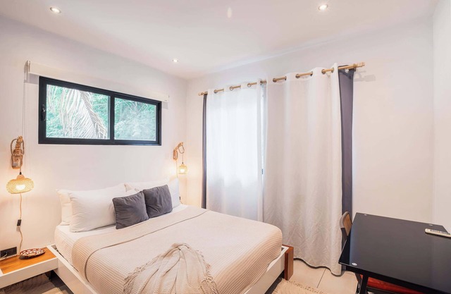 Location, location. One bedroom APT #2 is walking distance to shops, gym, surf a