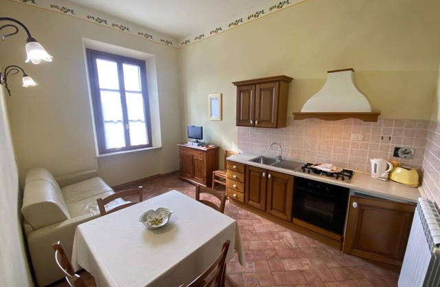 Lovely apartment in villa for 6 guests with pool, WIFI, TV, patio, panoramic view and parking