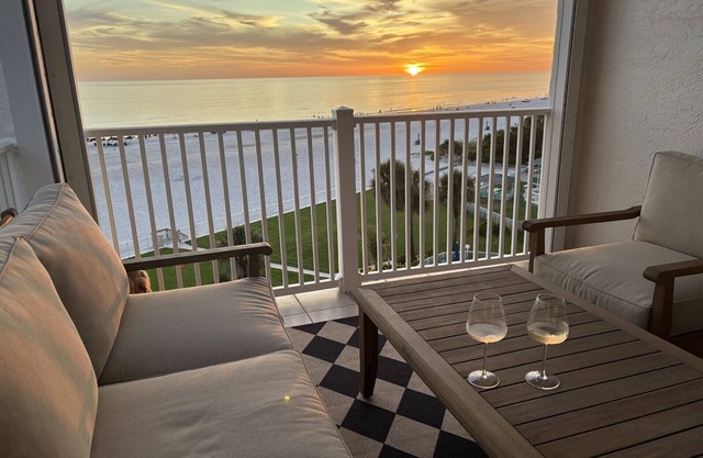 Luxurious Beachfront Boutique style corner unit Condo with Private Balcony!