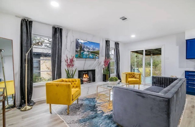 Luxurious Home with Hot tub, deck, creek view and modern amenities all in one!