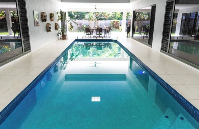 Luxury Tropical Escape: Beachside Villa with Heated Pool & Modern Comforts