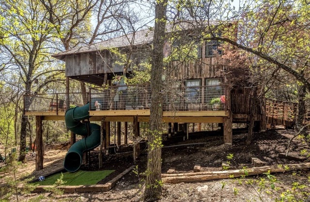 Magical Treehouse with Slide by Brazos River for Family Glamping Adventures in Texas
