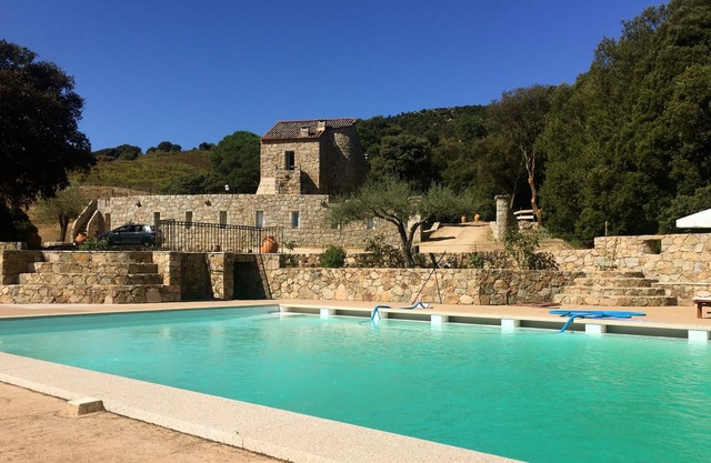 Medieval residence with swimming pool in the heart of a sixteen hectare property