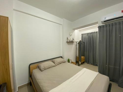 Minimalist room at The Nest Apartment by Popobella Near Puri Indah West Jakarta