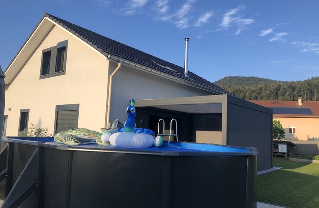 Modern house between mountains and countryside