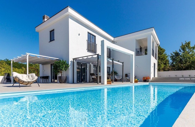 Modern 5* villa with a private pool in an idyllic surrounding..