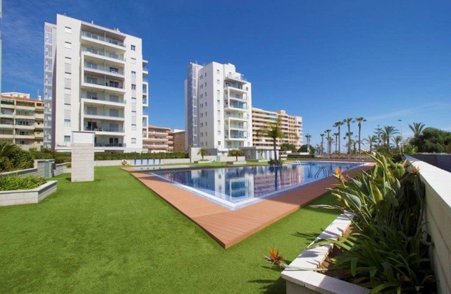 Modern ground floor apartment with 80m² terrace + parking at La Mata beach