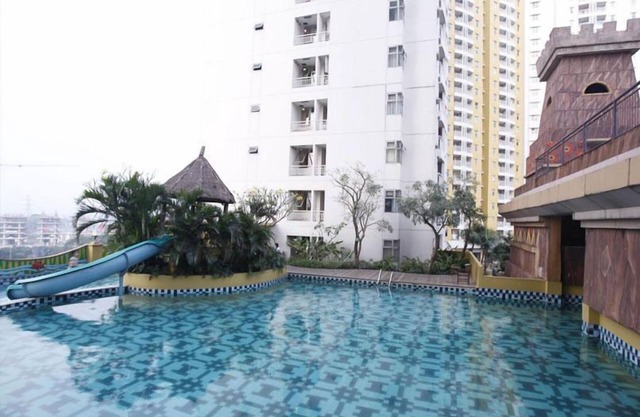 Modern Studio Grand Serpong Apartment By Travelio