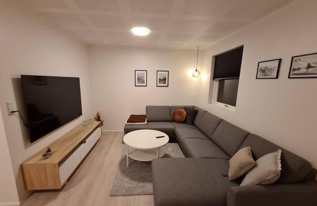 Modern unit with a king-size bed and a bathtub
