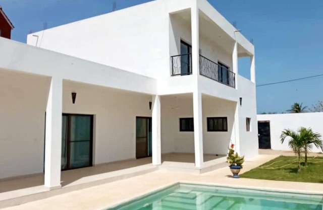 Modern villa with pool close to the sea and shops