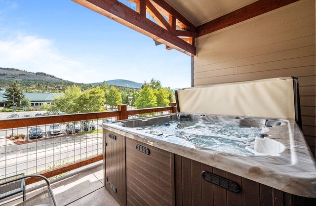 New Listing! River's Edge Condo - Private Hot Tub - Deck - Ideal Location