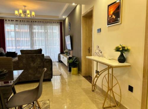 newly furnished two bedroom apartment with swimming pool, fully equipped gym, private parking space, children playground and unbeatable scenic city views in lavington