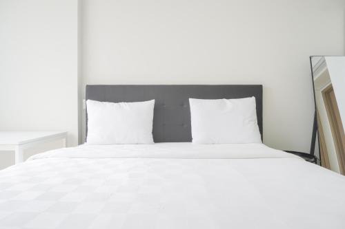 Nice and Homey 1BR at Gold Coast Apartment By Travelio
