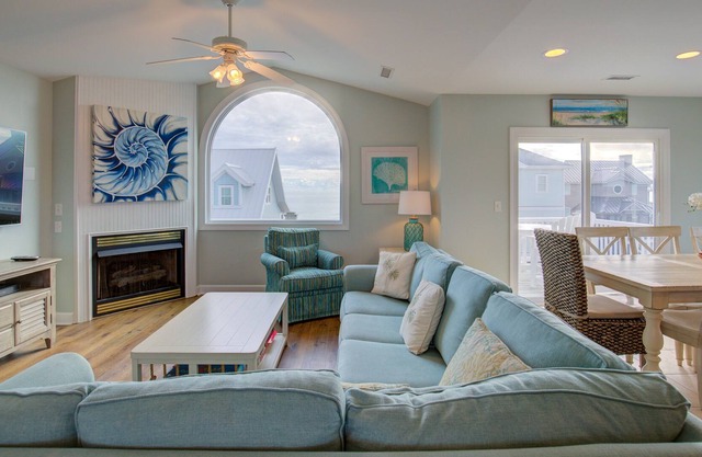 Ocean-view 2-story home with fireplace, community outdoor pool & tennis court