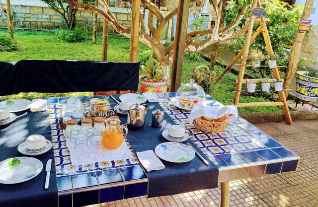 Organic breakfast in the garden, Vesuvius view