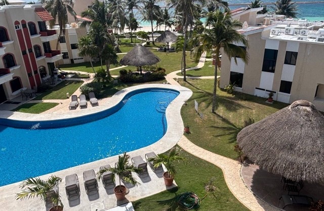 PlayaSol Beachfront Condo with large pool, steps to beach, walk to town square