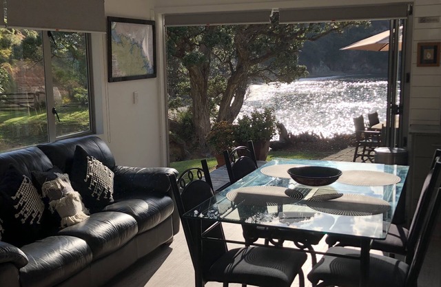 Private beach log cabin with boat ramp on 60 acre coastal property
