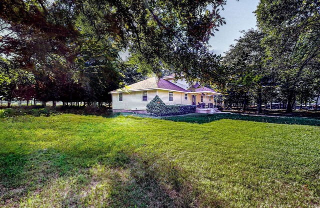 Private gated home on 5 acres near Lake Texoma with dog-friendly yard & firepit