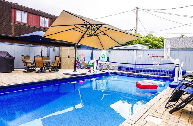 Private heated pool in back & Sandy beach in front