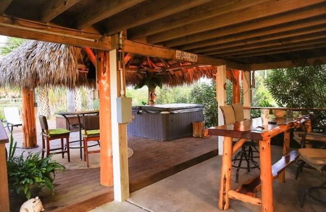 Private Hot Tub with outdoor shower and tiki area to relax and Enjoy!