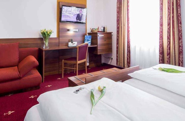 Quadruple room - Hotel Burgschmiet GmbH