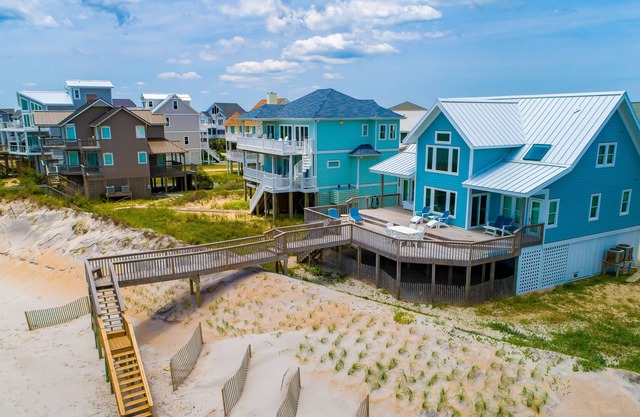 Quaint beachfront cottage with Ping-Pong table, decks, community pool & views